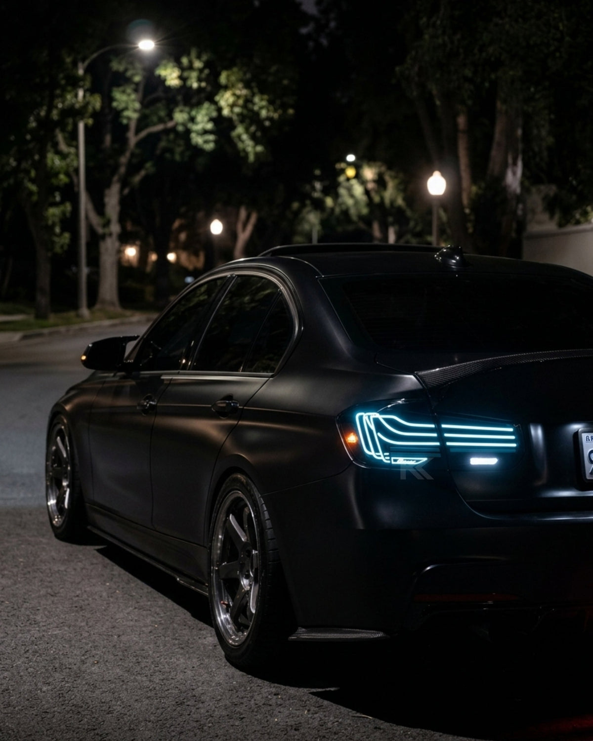 BMW 3-Series F30/F80 CSL laser-style tail lights with RGB color-changing LEDs, installed on a 2013-2018 model by K2 Industries