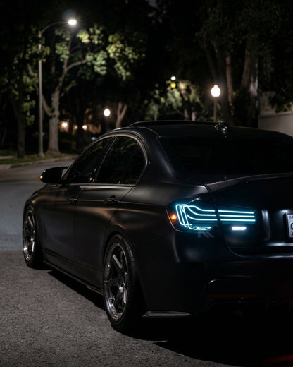 BMW 3-Series F30/F80 CSL laser-style tail lights with RGB color-changing LEDs, installed on a 2013-2018 model by K2 Industries
