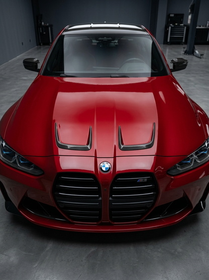 BMW 3/4 Series G80/G81/G82/G83 carbon fiber hood vents from K2 Industries, showing sleek, lightweight vent design on the car's hood.