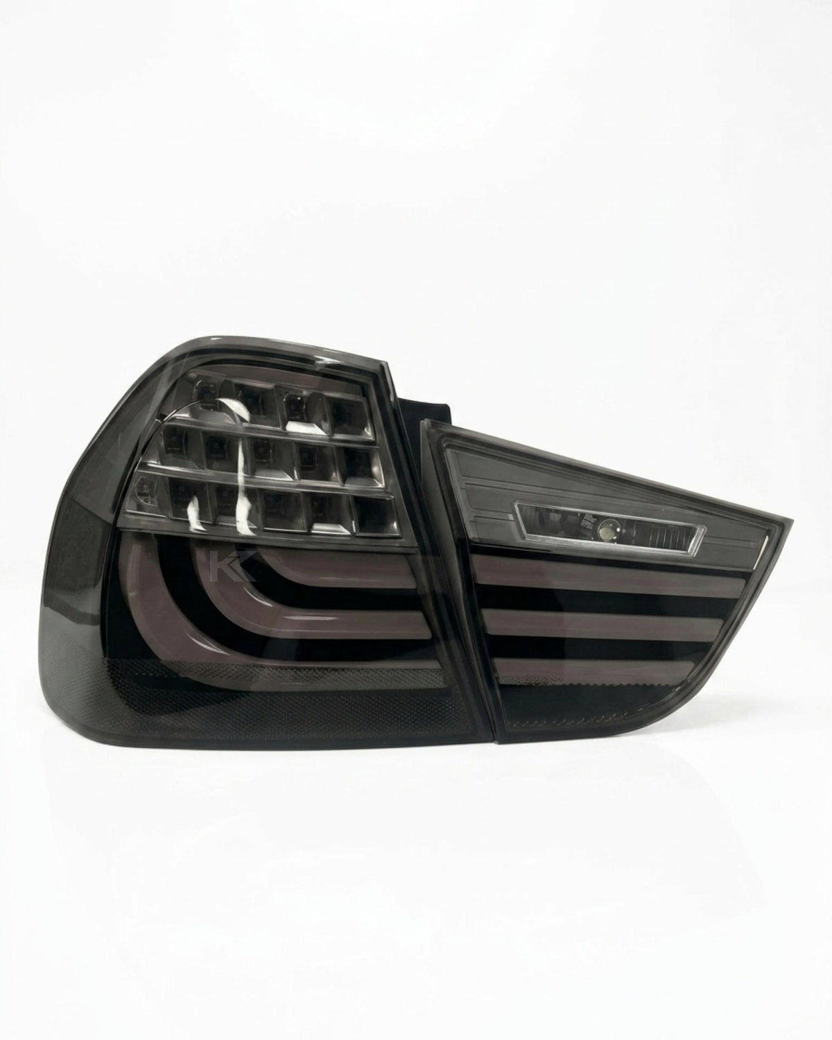 BMW 3 Series E90 upgraded LED tail light assembly by K2 Industries, showing the sleek red and clear lens design for 2009-2012.