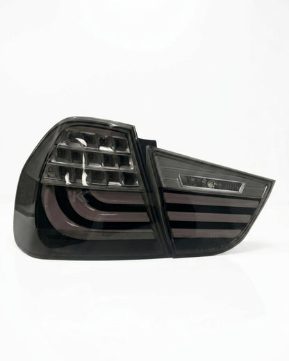 BMW 3 Series E90 upgraded LED tail light assembly by K2 Industries, showing the sleek red and clear lens design for 2009-2012.