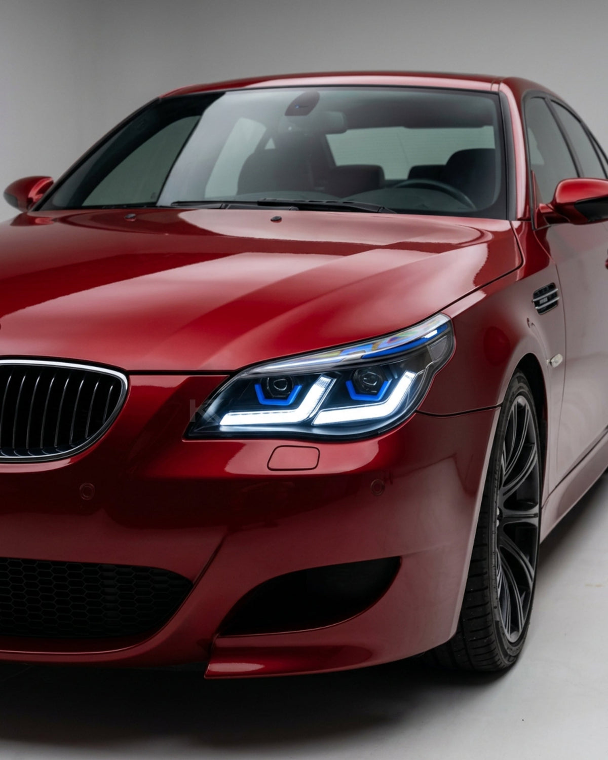 K2 Industries BMW 5-Series E60/E61 LED headlights for 2003-2010, modern style with clear lenses and integrated daytime running lights.