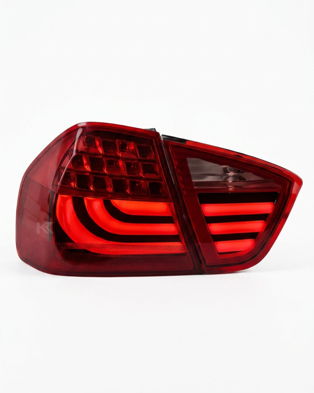 BMW 3-Series E90 tail light upgrade by K2 Industries, showing sleek black and clear lens design for 2006-2009 models.