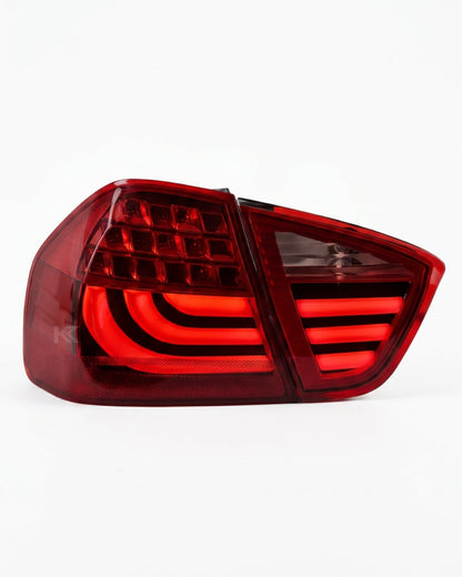 BMW 3-Series E90 tail light upgrade by K2 Industries, showing sleek black and clear lens design for 2006-2009 models.