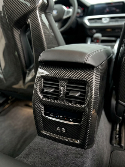 BMW 3 Series G80 G82 M3 M4 carbon fiber rear console trim by K2 Industries, showcasing sleek interior interior detailing.