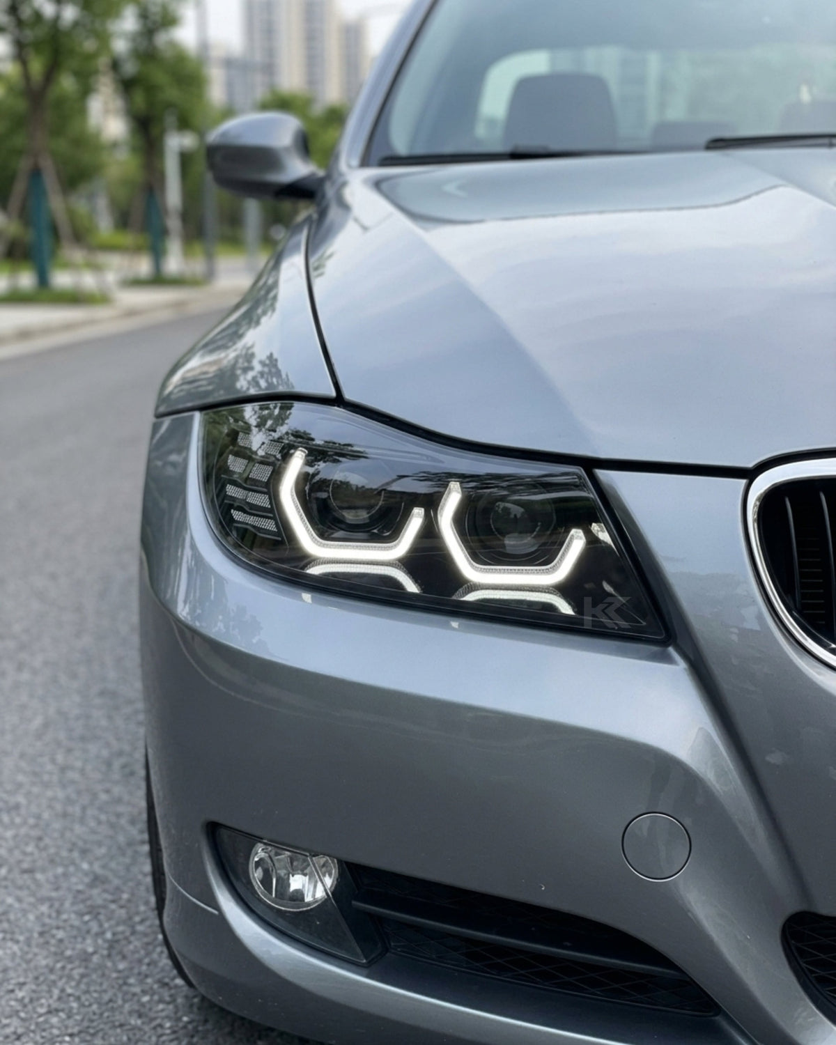 BMW 3-Series E90/E91 headlights by K2 Industries, model TRON, showing the sleek headlight design for 2005-2012 vehicles.