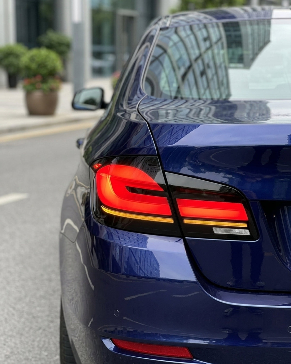 BMW 5-Series F10 F18 clear tail lights in G30 style by K2 Industries, showing the sleek, modern design for 2011-2017 models.
