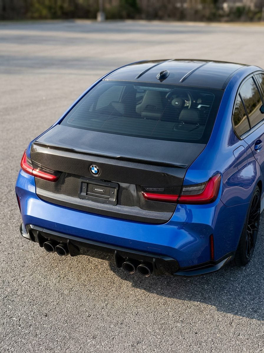 BMW 3 Series G80 M3 carbon fiber trunk by K2 Industries, showing the sleek, lightweight OEM style trunk with textured carbon fiber finish.