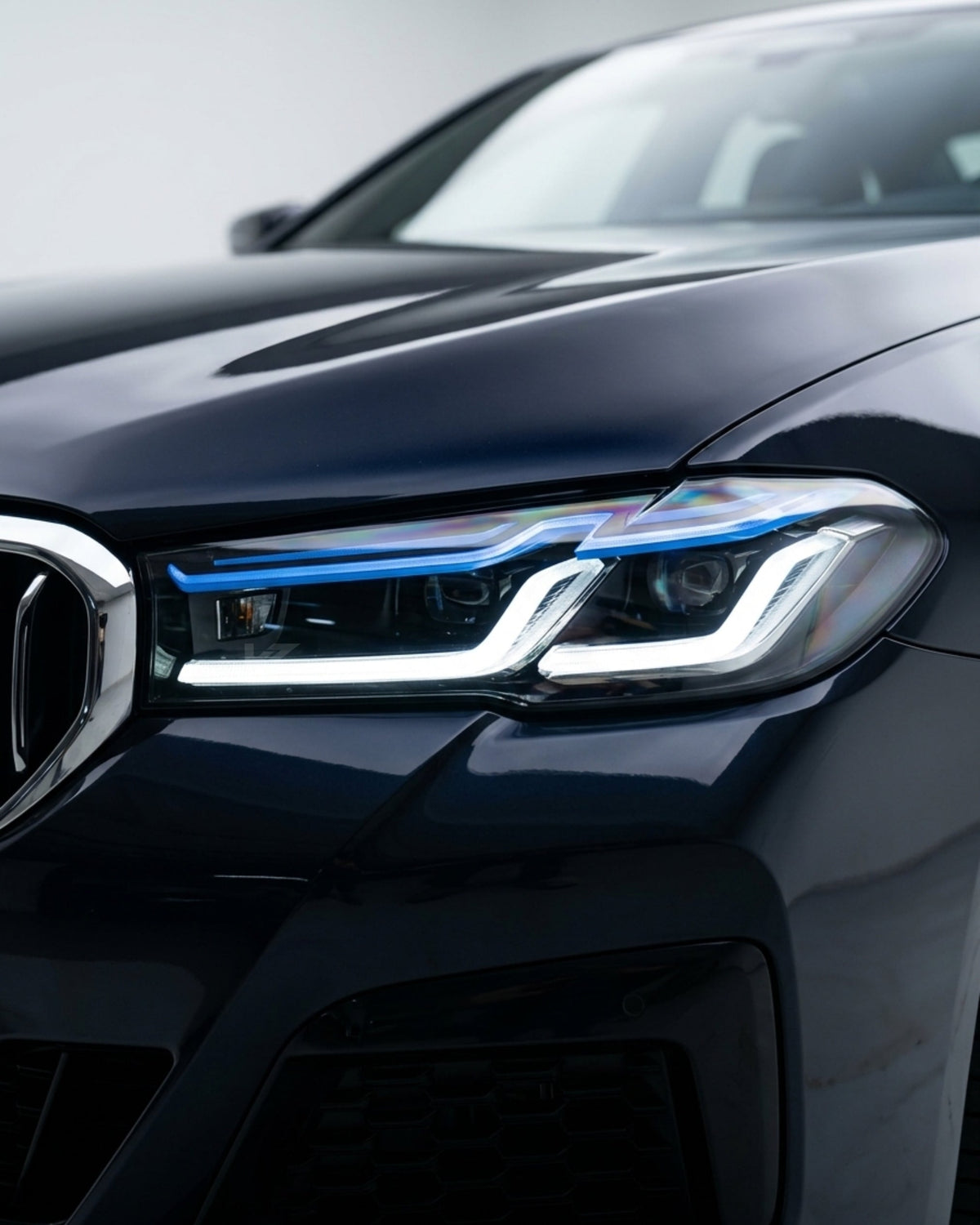 BMW 5-Series G38 G30 Laser LED headlights by K2 Industries, featuring sleek design and bright illumination in a close-up view.