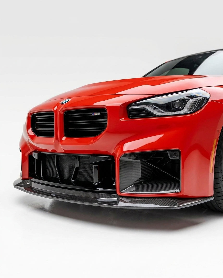 BMW 2 Series G87 M2 MHC Style carbon fiber front lip by K2 Industries, showcasing a sleek, aerodynamic design on a sporty car.