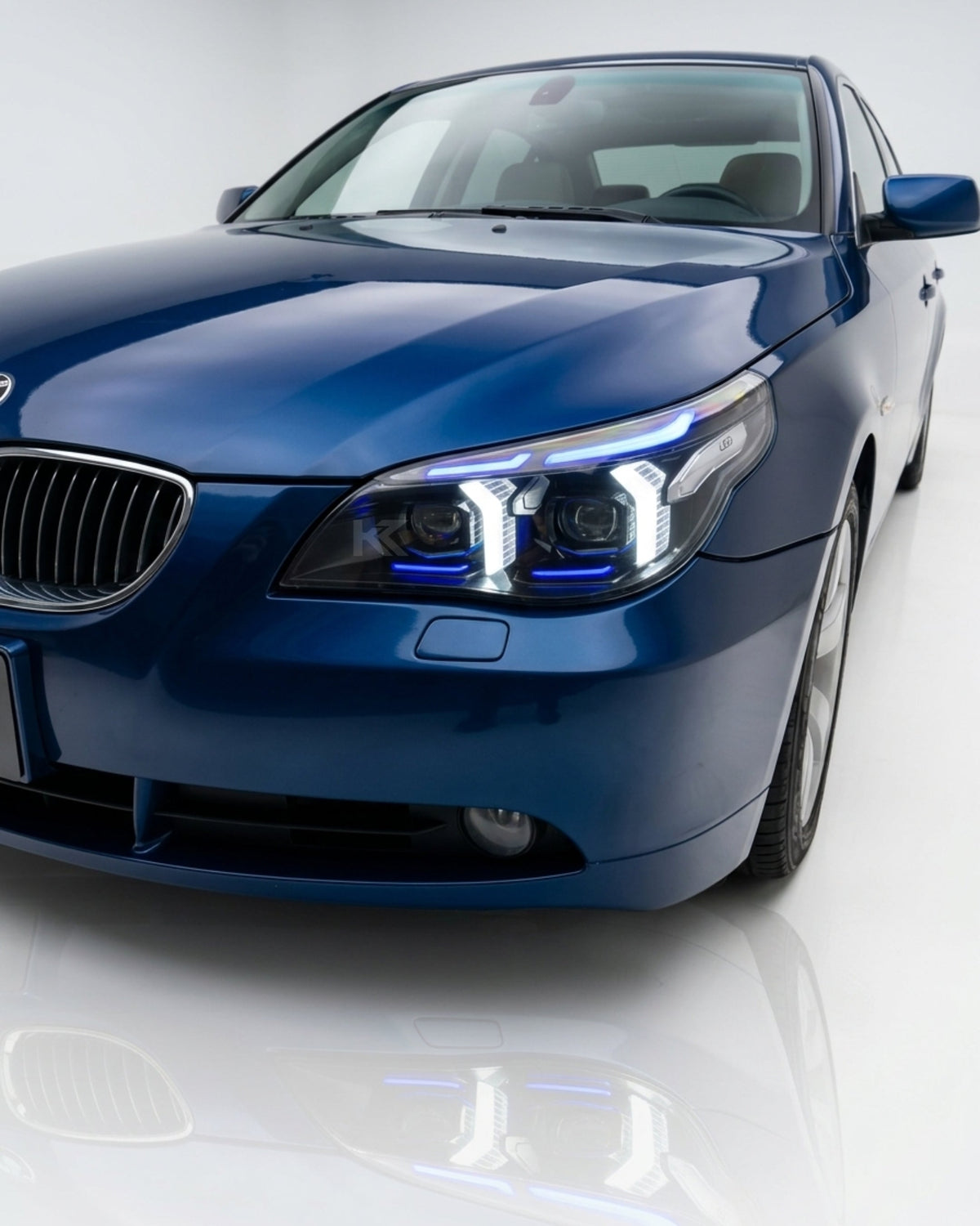 BMW 5 Series E60 Snake Eye LED headlight assembly with dual-color DRL from K2 Industries, showing the LED design and headlight housing.