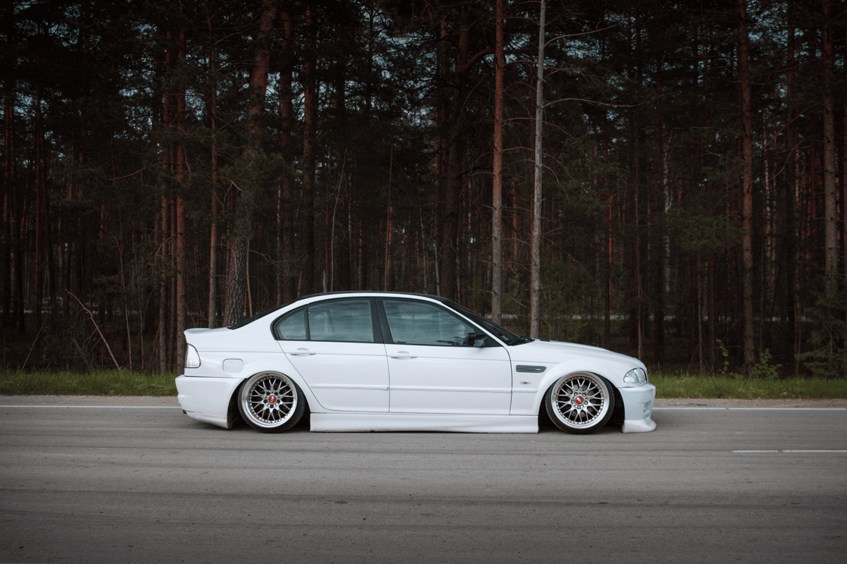 BMW 3-Series E46 sedan clear tail lights by K2 Industries, showing the sleek, transparent design for 1998-2006 models.