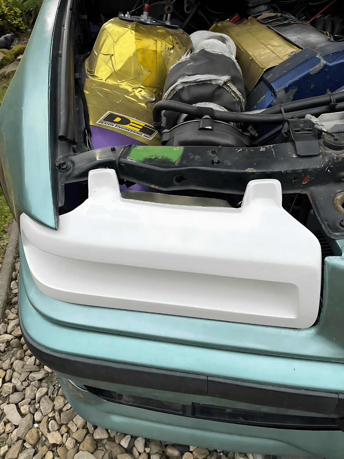 BMW 3 Series E36 headlight duct by K2 Industries, featuring the distinctive "The Eye" design, for models 1990-1999.