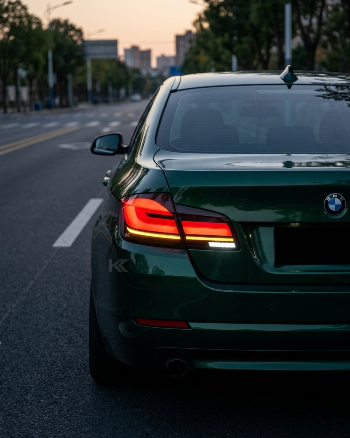 BMW 5-Series F10 F18 clear tail lights with G30 style, installed on a 2011-2017 model, by K2 Industries.