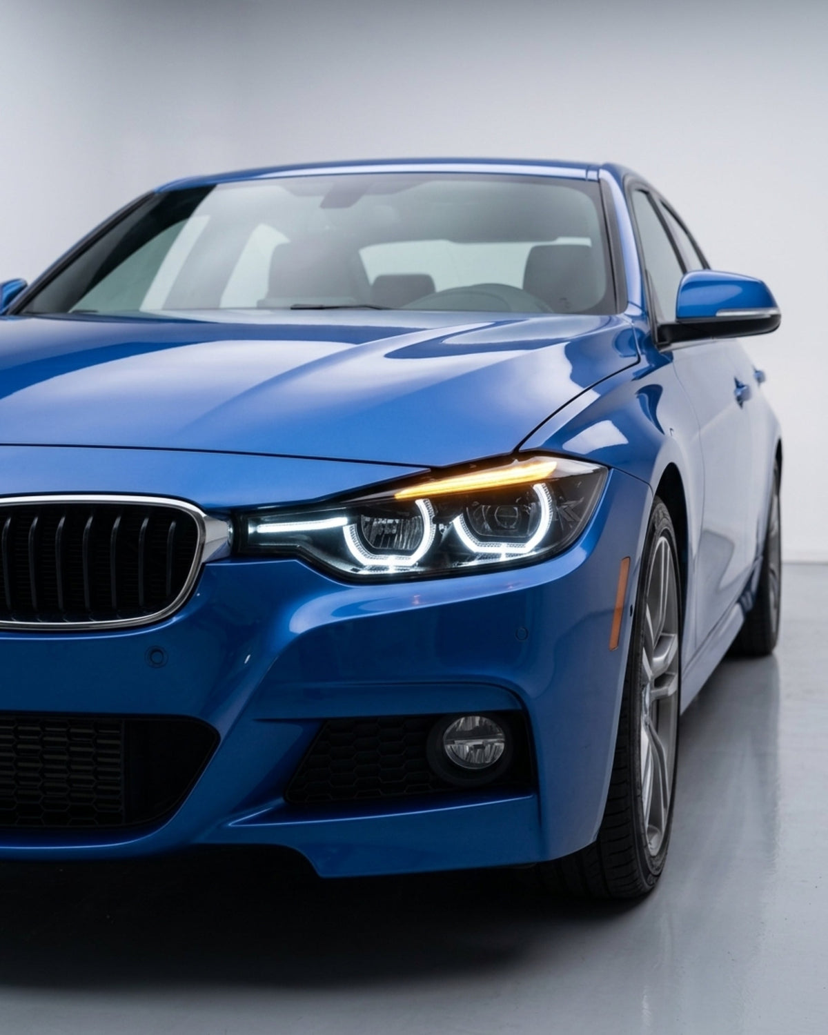 BMW 3 Series F30/F31/F35 V3 smoked triple-color LED headlight assembly with white, yellow, and red DRL by K2 Industries.
