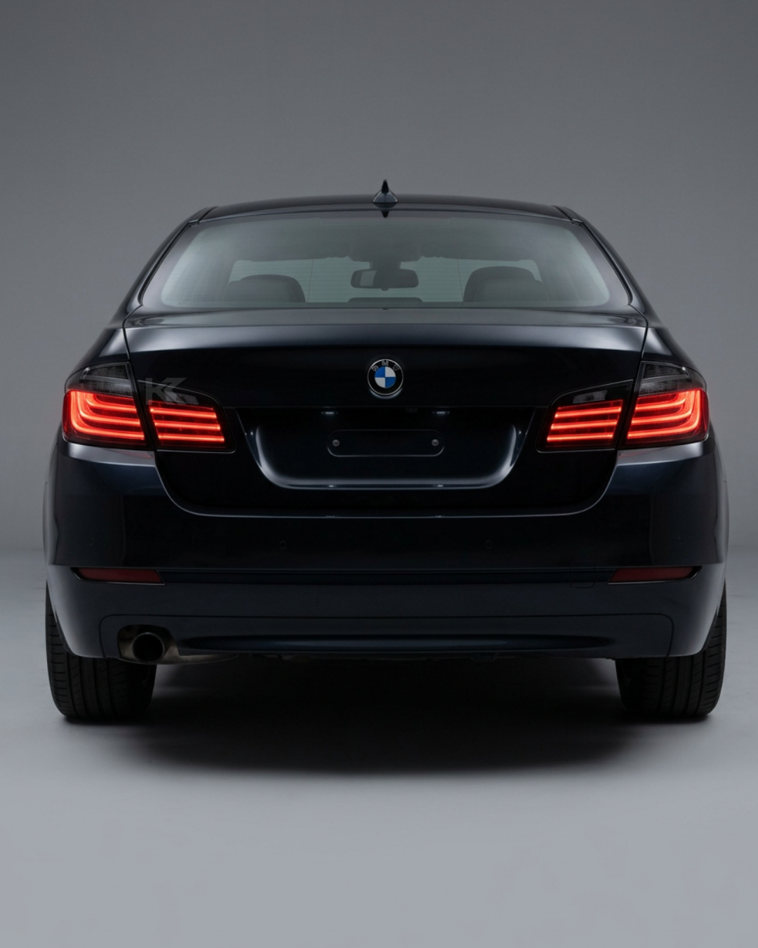 BMW 5 Series F10 BlackLine Style LED tail lights by K2 Industries, showing sleek black housing and bright LED illumination.