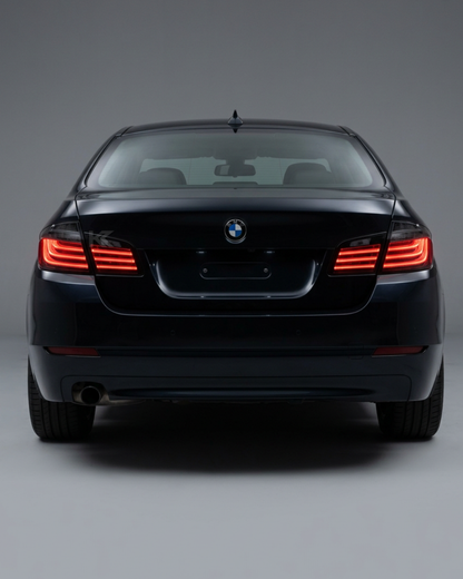 BMW 5 Series F10 BlackLine Style LED tail lights by K2 Industries, showing sleek black housing and bright LED illumination.
