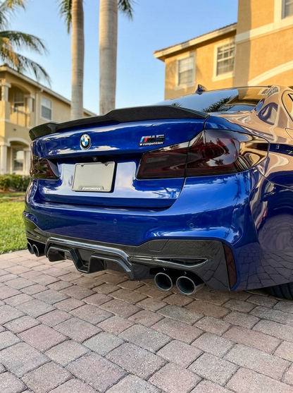 BMW 5 Series F90 M5 CS style carbon fiber rear diffuser by K2 Industries, showcasing sleek, textured carbon fiber design.