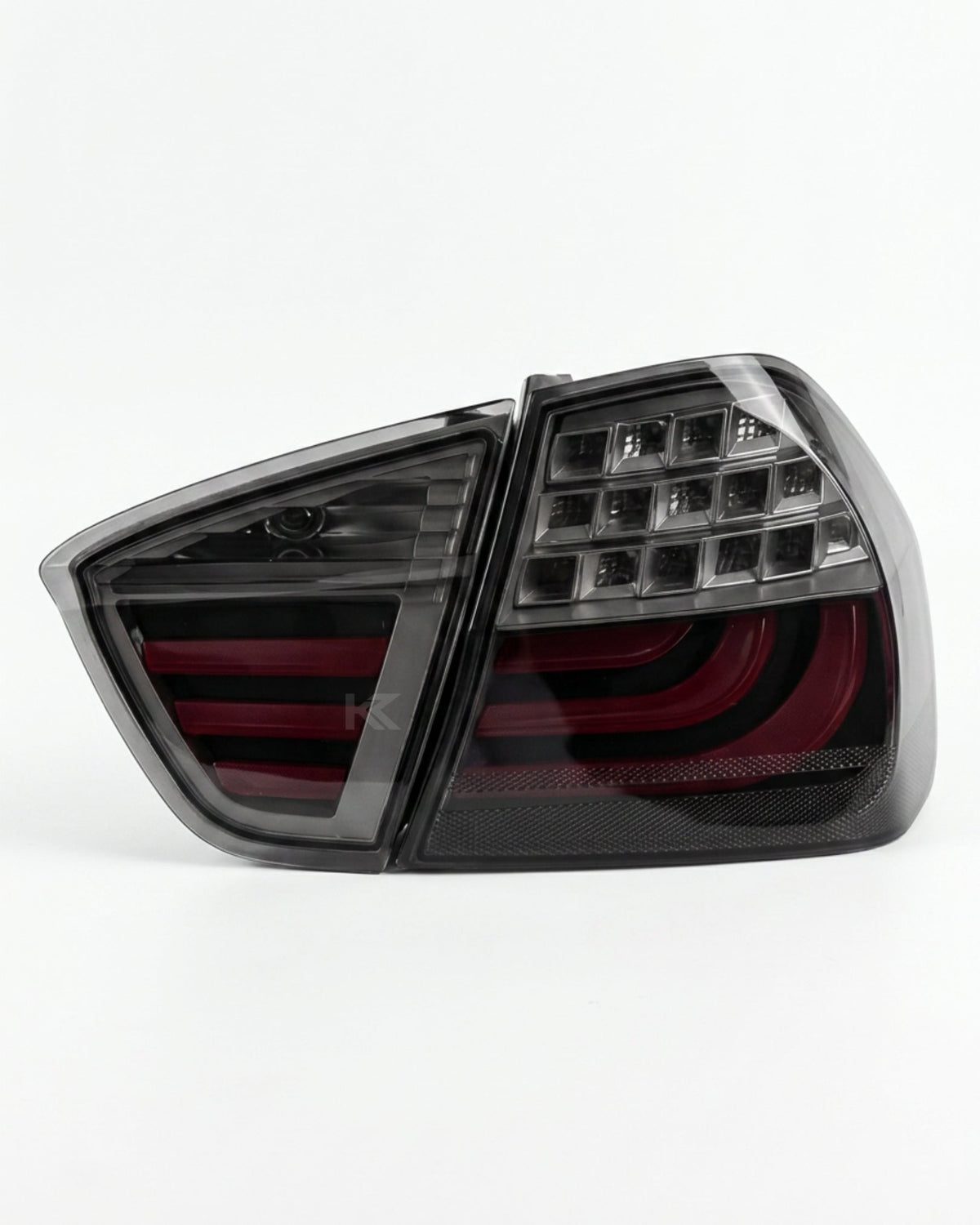 BMW 3-Series E90 tail light upgrade by K2 Industries, showing sleek red and clear lens tail lights for models 2006-2009.