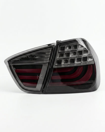 BMW 3-Series E90 tail light upgrade by K2 Industries, showing sleek red and clear lens tail lights for models 2006-2009.