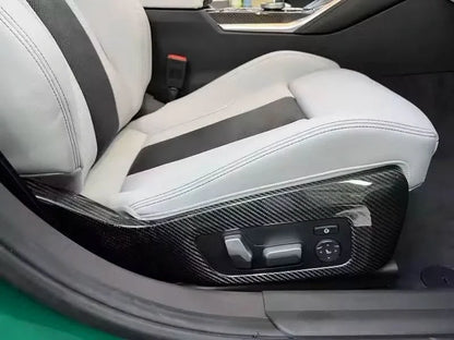 BMW 3 Series G80 M3 G82 M4 carbon fiber interior side seat trim frame panel cover by K2 Industries, showcasing sleek textured finish.