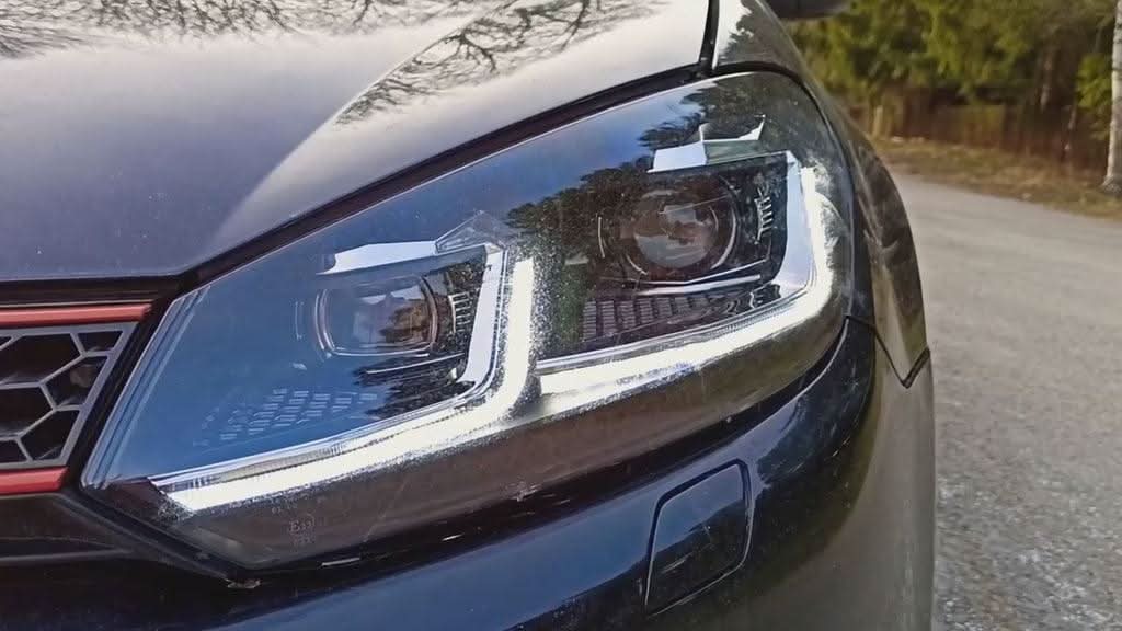 Volkswagen Golf MK6 headlights by K2 Industries with red, silver, black projector lenses and dynamic signal LED lights, 2009-2013.
