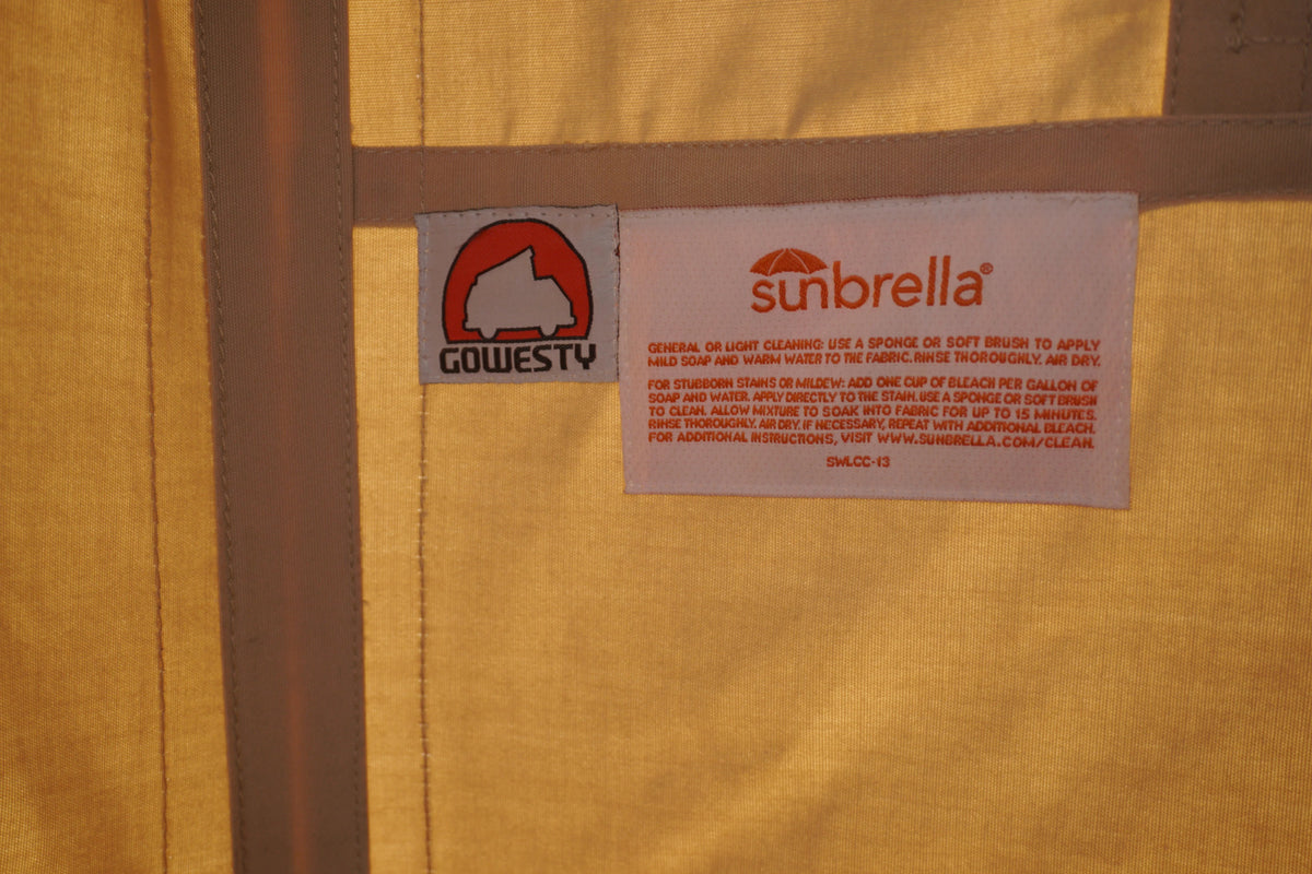 GoWesty cotton pop-top tent set up on a late Vanagon camper for outdoor camping and vehicle accommodation.