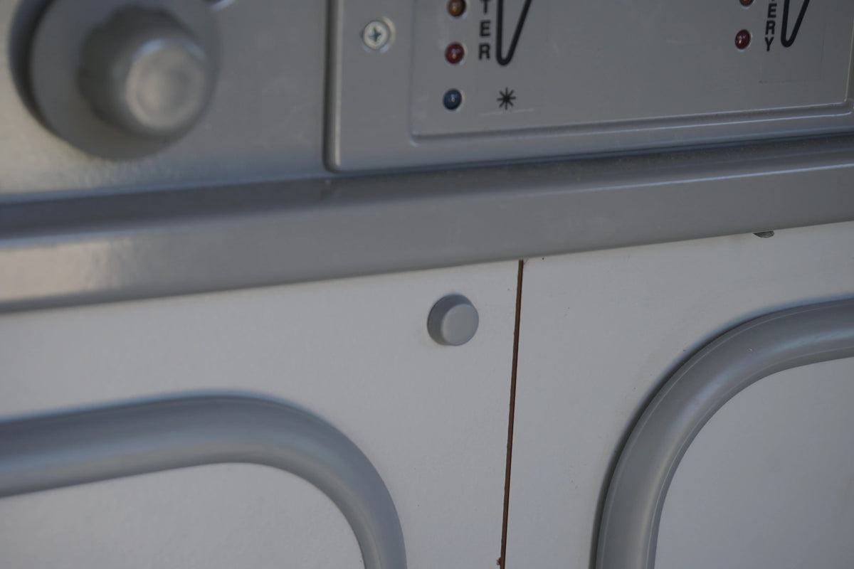 Set of five GoWesty interior screw caps for Vanagon, shown in a close-up image with the caps installed inside the vehicle.