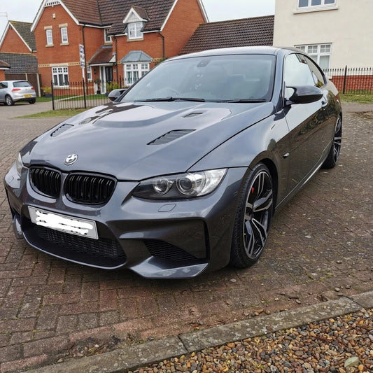 Glossy black ABS M Style mirror caps for BMW E92/E93 328i, 335i, 335is, by Palenon Performance, showing sleek mirror cover design.