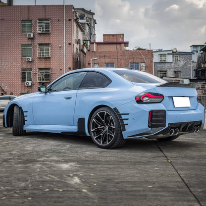 BMW G87 M2 rear side fins diffuser in M Performance style by K2 Industries, showcasing sleek aerodynamic design.