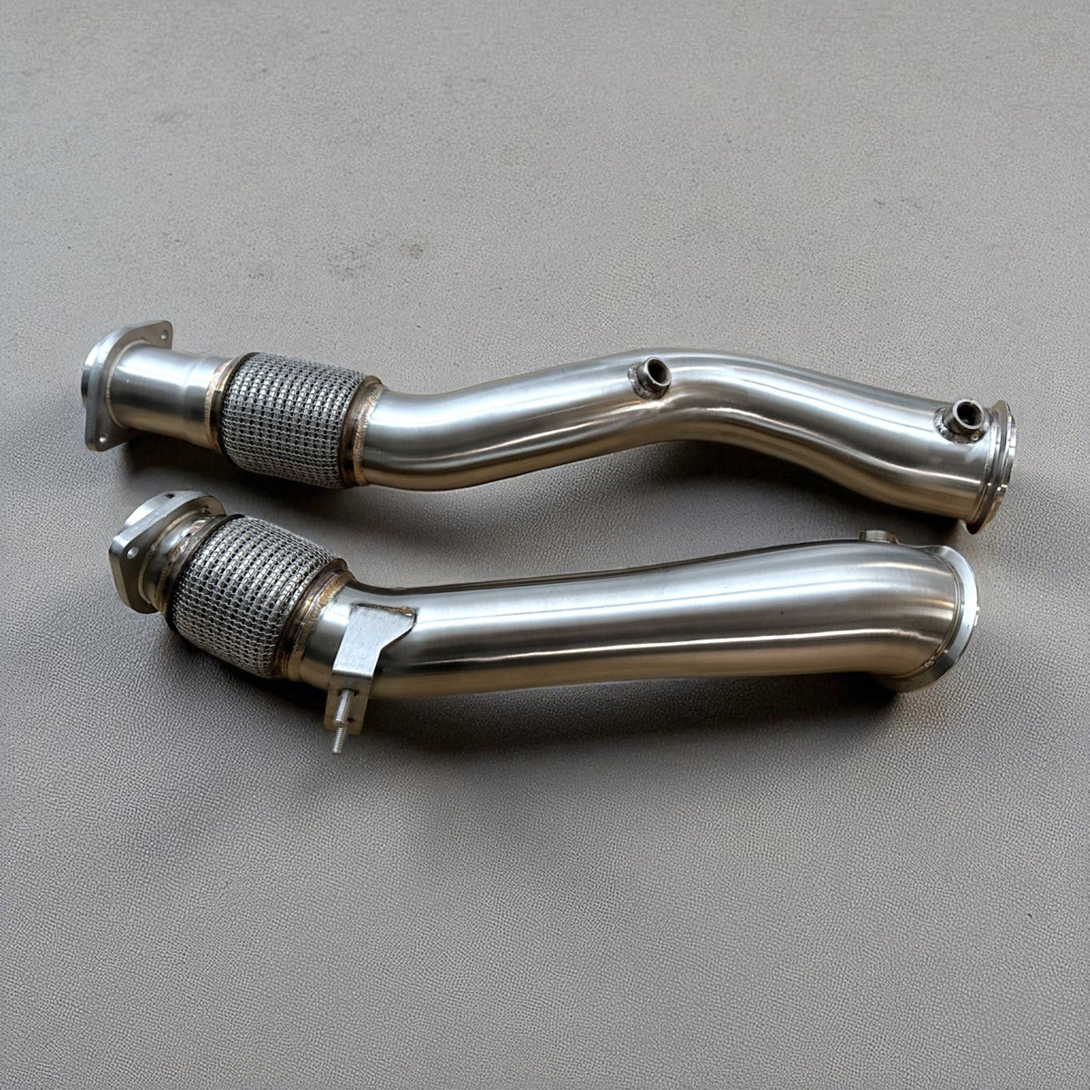 BMW S58 X3M and X4M catless race downpipe by Palenon Performance, 3.5-inch exhaust pipe with detailed metal construction.