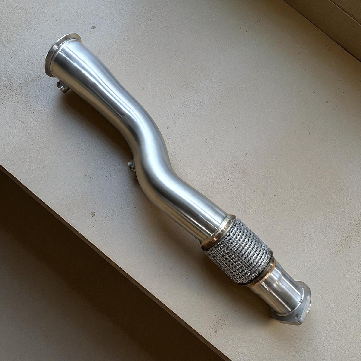 BMW S58 X3M and X4M catless race downpipe by Palenon Performance, 3.5-inch exhaust pipe with polished metal finish