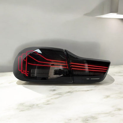 BMW F82 M4 and F32 4 Series CSL-style laser tail lights by Palenon Performance, showcasing sleek red and clear LED taillight design.
