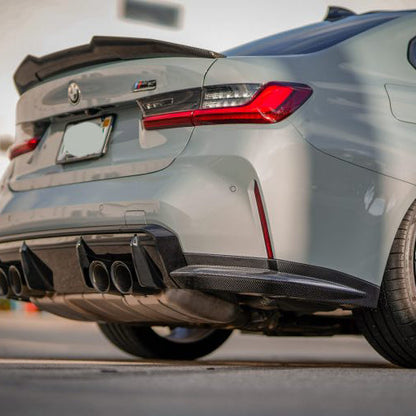 BMW G80 M3 and G82/G83 M4 carbon fiber OEM rear canard splitter flaps from Palenon Performance, showing the lightweight aerodynamic design.