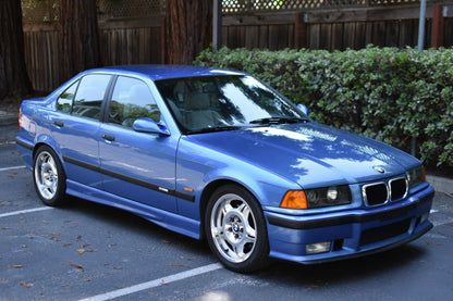 BMW E36 sedan/compact amber corner lights by K2 Industries, close-up showing clear plastic lens and amber reflector details.