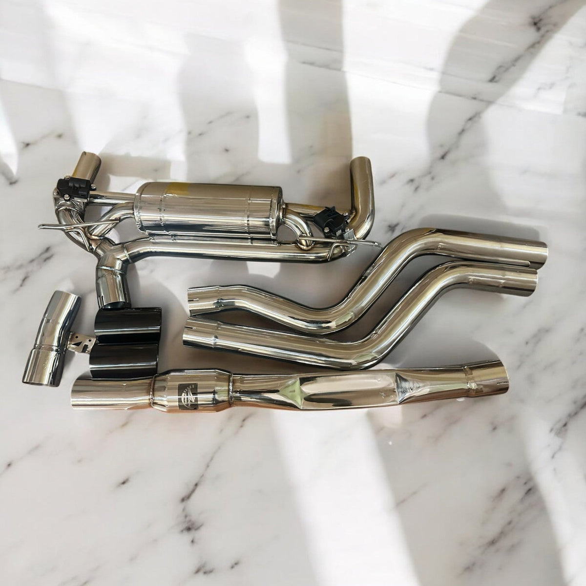 BMW F30 340i B58 full valve performance exhaust system by Palenon Performance, showcasing the sleek exhaust pipes and muffler.