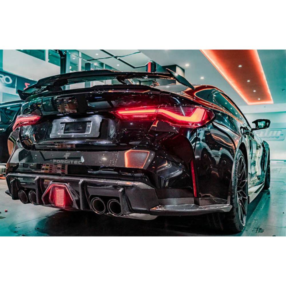 BMW G80 G82 M3 M4 ABS V Style LED diffuser by Palenon Performance, featuring carbon fiber rear diffuser with LED rain light.