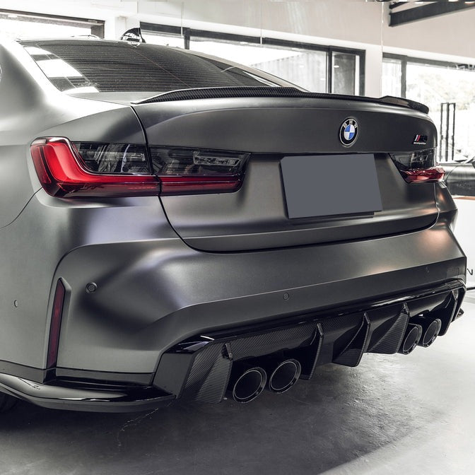 Carbon fiber rear diffuser for BMW G80 M3 and G82/G83 M4, featuring sleek aerodynamic design by Palenon Performance.