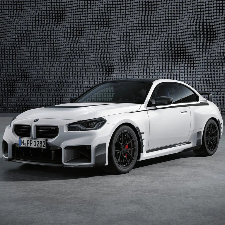 Carbon fiber M style front lip for BMW M2 G87, designed by Palenon Performance, installed on front bumper of the vehicle.
