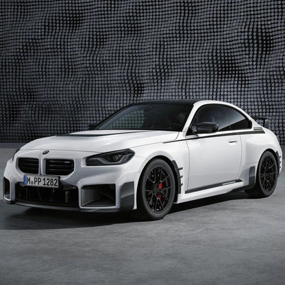 Carbon fiber M style front lip for BMW M2 G87, designed by Palenon Performance, installed on front bumper of the vehicle.