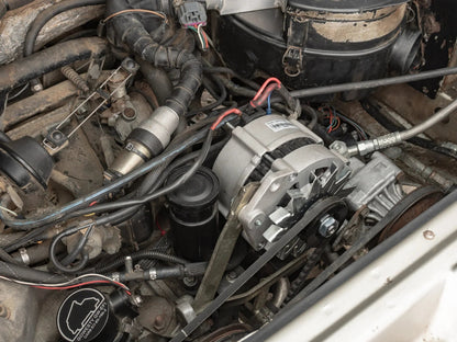 Watercooled Vanagon 90A alternator by GoWesty, shown installed with cooling components and wiring.