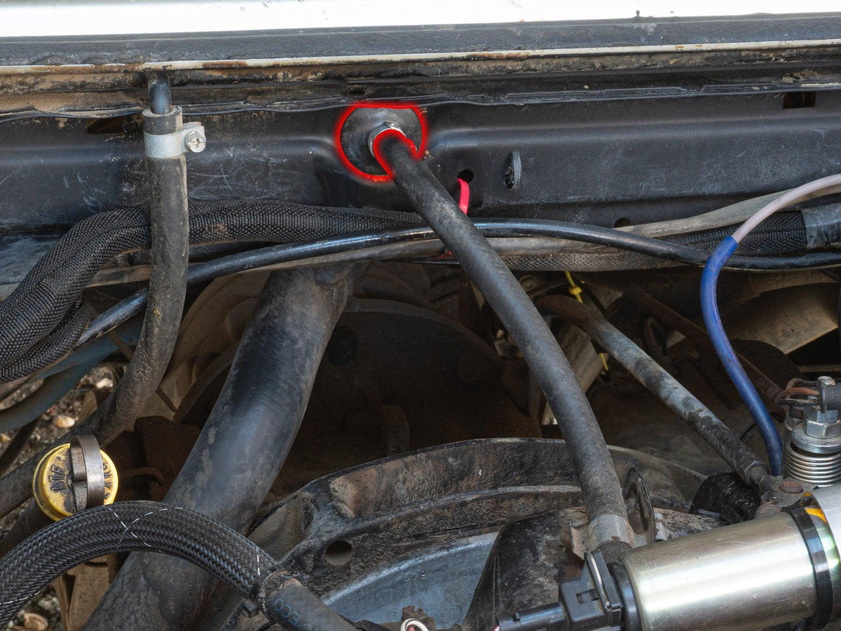 GoWesty Firewall Grommet for Fuel Return Side on 2WD Vanagon, showing installation with the grommet in place.