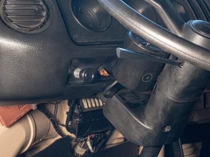 GoWesty OEM-style vacuum switch kit with black switch and wiring, designed for locker or decoupler systems in engine compartments.