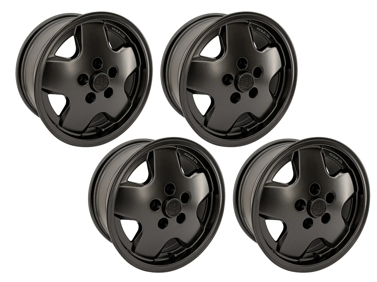 Set of four GoWesty OEM replica alloy wheels for Bus and Vanagon, available in 15", 16", and 17" sizes, black finish.