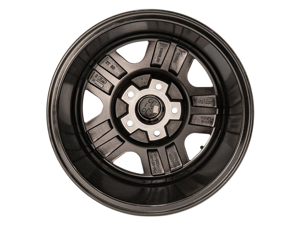 GoWesty OEM replica alloy wheel bundle for Bus/Vanagon, 15-inch black wheel with detailed back view.