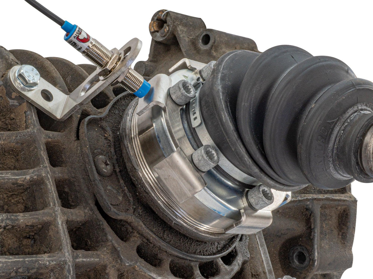 GoWesty vehicle speed sensor kit installed on axle, showing wiring and mounting for accurate speed measurement in a vehicle.