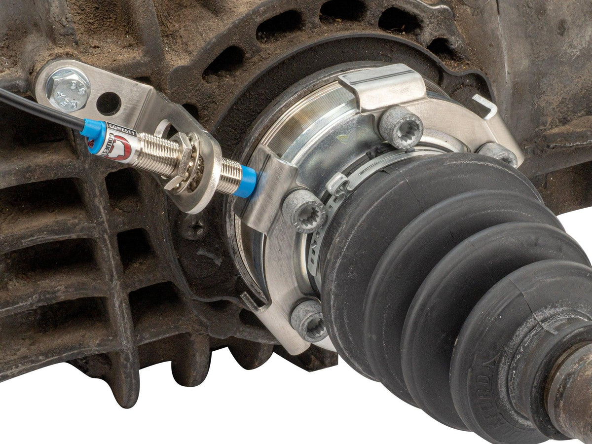 GoWesty vehicle speed sensor kit installed on axle, showing the sensor and wiring for accurate speed measurement.