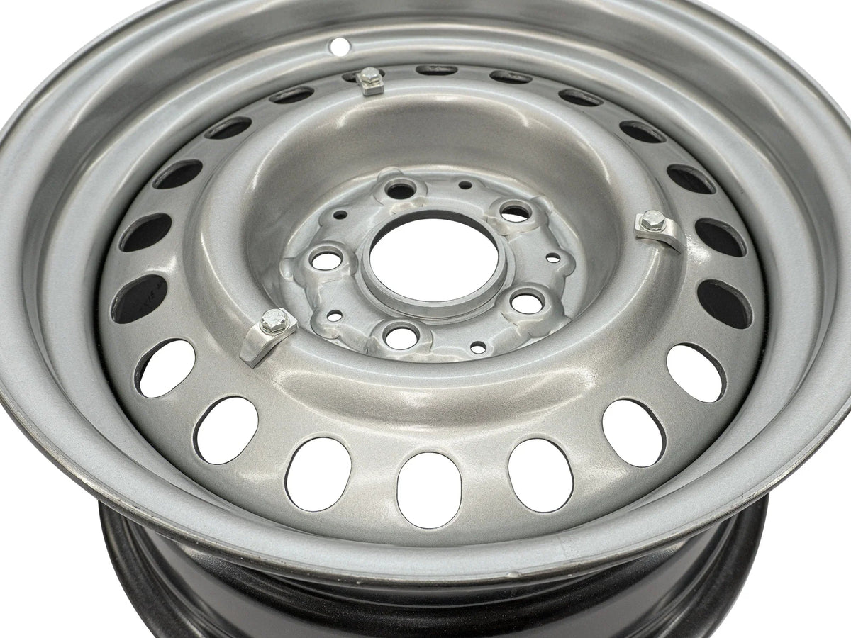 GoWesty steel wheel hubcap mounting kit installed on wheel, showing the secure attachment of the hubcap to the wheel.