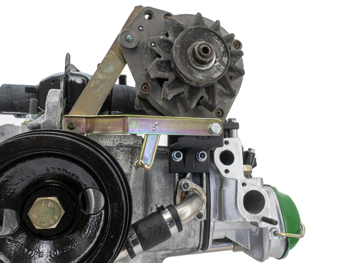 GoWesty upgraded alternator bracket kit installed on a 1983-1991 Vanagon engine for improved alternator support and alignment.