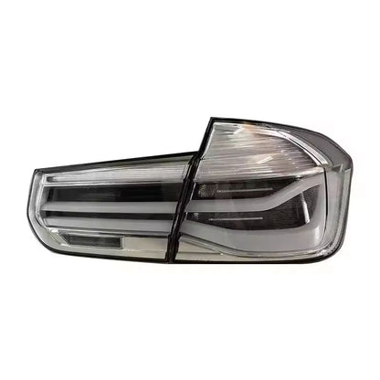 Vekto MP Style clear LED tail lights for BMW 3 Series F30/F35 2012-2018, showing sleek taillight design on a vehicle.